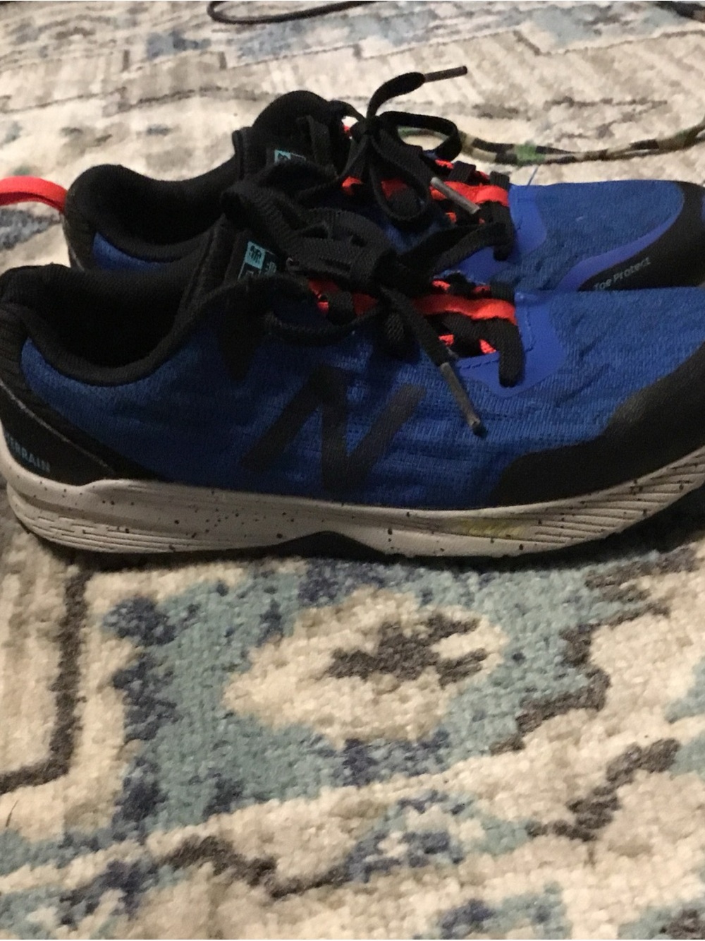 New Balance Boys Blue and Black Sneakers with Red Lace Highlights